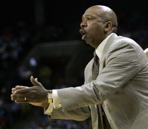 Head coach Oliver Purnell encourages his team as they play Boston College in the first half.