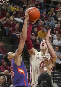 Florida State's Deividas Dulkys (4) has his shot blocked by Clemson guard K.J. McDaniels (32) in the second half. (AP Photo/Phil Sears)