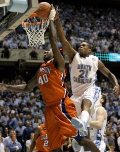 Clemson's James Mays (40) has a shot blocked by North Carolina's Deon Thompson (21) during the second half of a college basketball game in Chapel Hill, N.C., Sunday, Feb. 10, 2008. North Carolina won 103-93 in double overtime. (AP Photo/Gerry Broome)