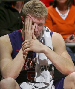 Clemson's Tanner Smith rubs his head after a hard landing on the floor in the second half. (AP Photo/Phil Sears)