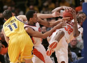 Clemson's Sam Perry (32) fights for the ball with West Virginia's Joe Alexander (11) as teammate Cliff Hammonds is caught in the middle in the first half. (AP Photo/Frank Franklin II)