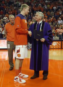 Tanner Smith, President James F. Barker, diploma