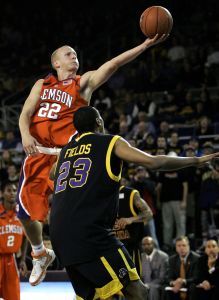 Terrence Oglesby (22) drives to the basket as East Carolina's John Fields (23) defends during the second half of a college basketball game in Greenville, N.C., Wednesday, Dec. 5, 2007. Clemson won 82-67. Ogelsby scored a season-high 22 points. (AP Photo/Gerry Broome)