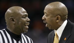 Oliver Purnell talks with an official. (AP Photo/Gerry Broome)