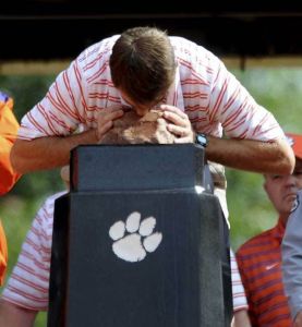 Clemson's interim head coach Dabo Swinney kisses Howard's Rock before the start of the game.