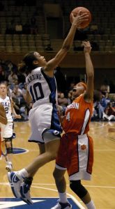 Duke's Lindsay Harding (10) blocks the shot by Clemson's Christy Brown (4) in the second half of a basketball game in Durham, N.C., on Monday, Feb. 5, 2007. Duke won 105-53 over Clemson. (AP Photo/Sara D. Davis)