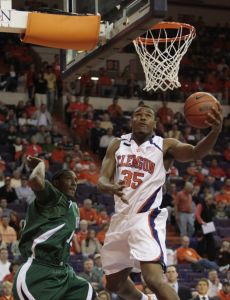 Clemson's Trevors Booker shoots against Charlotte's Lamont Mack during the first half.