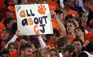 fans cheer sign it's all about CJ