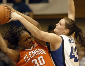 Duke's Alison Bales, right, pressures Clemson's Moreemi Davis (30) in the second half of a basketball game in Durham, N.C., on Monday, Feb. 5, 2007. Bales led her team with 21 points for Duke's 105-53 win over Clemson. (AP Photo/Sara D. Davis)