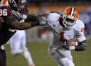 Clemson running back James Davis, right, breaks the tackle of Aaron Rouse (36) on his way to the endzone during the Clemson-Virginia Tech Atlantic Coast conference college football game in Blacksburg, Va., Thursday, Oct. 26, 2006. (AP Photo/Don Petersen)