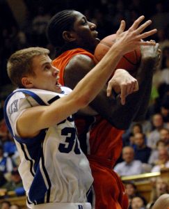 Duke's Jon Scheyer, left, gets tangled with Clemson's James Mays, right, in the second half of a basketball game in Durham, N.C., Saturday, Jan. 19, 2008. Duke won 93-80 over Clemson.