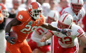 Clemson running back C.J. Spiller, left, returns a punt during the first quarter as Nebraska's T.J. O'Leary moves in to make the tackle during the Gator Bowl. (AP Photo/Phil Coale)
