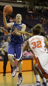 Duke's Abby Waner (4) gets fouled as she drives for the basket by Clemson's Morganne Campbell (32) during the first half of their basketball game Wednesday, Feb. 13, 2008, in Clemson, S.C. (AP Photo/Mary Ann Chastain)