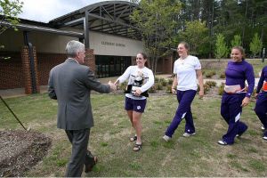The 2009 ACC Champion Tiger rowing team returned to Clemson on Monday afternoon after winning its first-ever conference title on Monday morning in Oak Ridge, TN.