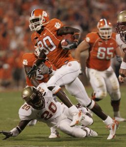 Clemson's Aaron Kelly (80) runs for a touchdown as Florida State's Jamie Robinson (20) tries to stop him during the second quarter of their football game Monday Sept. 3, 2007, at Memorial Stadium in Clemson, S.C. (AP Photo/John Byrum)