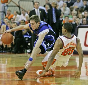 Duke's Greg Paulus tries to keep control of the ball as he collides with Clemson's Cliff Hammonds (25) during the first half of their basketball game Thursday, Feb. 22, 2007, at Littlejohn Coliseum in Clemson, S.C. (AP Photo/Mary Ann Chastain)