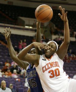 Clemson's Moreemi Davis (30) battles for the rebound with Duke's Brittany Mitchell (15) during the first half of their basketball game Wednesday, Feb. 13, 2008, in Clemson, S.C. (AP Photo/Mary Ann Chastain)