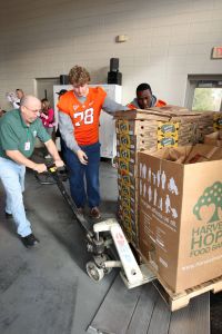 Members of the Clemson football team spent the morning of Monday, December 20 volunteering at Harvest Hope Food Bank in Greenville.