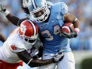 Clemson cornerback Xavier Brewer tries to bring down North Carolina running back Johnny White (34). (AP Photo/Jim R. Bounds)