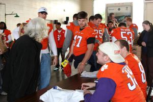 Members of the Clemson football team spent the morning of Monday, December 20 volunteering at Harvest Hope Food Bank in Greenville.