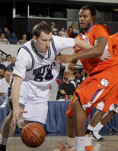 Butler's Matt Howard, left, drives past Clemson's Trevor Booker during the first half of an NCAA college basketball game in the 76 Classic in Anaheim, Calif., Sunday, Nov. 29, 2009.