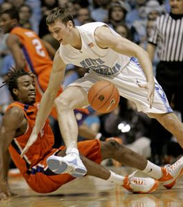 Clemson's Raymond Sykes, left, tries to guard North Carolina's Tyler Hansbrough during the second half of a college basketball game in Chapel Hill, N.C., Sunday, Feb. 10, 2008. North Carolina won 103-93 in double overtime. (AP Photo/Gerry Broome)
