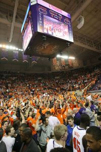 postgame celebration students court scoreboard