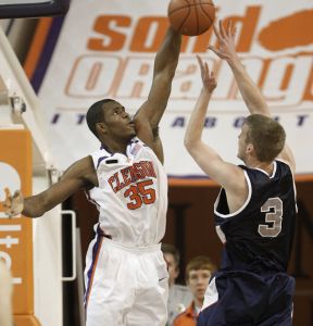Clemson's Trevor Booker, left, block a shot by Samford's Jim Griffin during the first half of a basketball game in Clemson, S.C., Saturday, Dec. 29, 2007. Clemson won 78-45. (AP Photo/Patrick Collard)