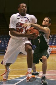Mayaguez' Octavio Santiago, right, blocks Clemson's Sam Perry during a San Juan Shoot Out basketball tournament game in Guaynabo, Puerto Rico, Thursday, Dec. 20, 2007. (AP Photo/Brennan Linsley)
