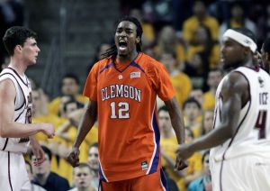 Clemson's Raymond Sykes celebrates a basket between Boston College's Joe Trapani, left, and Tyrese Rice in the second half of an NCAA college basketball game, Tuesday, Feb 10, 2009, in Boston. Clemson won 87-77. (AP Photo/Michael Dwyer)
