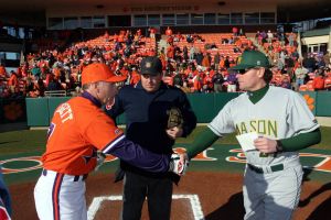 Clemson head coach Jack Leggett exchanging lineup cards