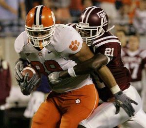 Clemson's Thomas Hunter (89) holds on to the catch as Temple's Dominique Harris (21) tries to strip the ball away during the first half of their football game Thursday, Oct. 12, 2006, at the Bank of America Stadium in Charlotte, N.C. (AP Photo/Mary Ann Chastain)