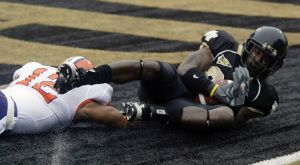 Wake Forest's Willie Idlette, right, ctaches a touchdown pass as Clemson's C.J.Gattis (12) defends during the first quarter of a college football game in Winston-Salem, N.C., Saturday, Oct. 7, 2006. (AP Photo/Rick Havner)