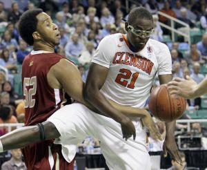 Clemson's Bryan Narcisse (21) and Boston College's Josh Southern (52) battle for a rebound in the first half of an NCAA college basketball game at the Atlantic Coast Conference tournament in Greensboro, N.C., Friday, March 11, 2011. (AP Photo/Gerry Broome)