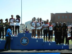 Women's 4x100 relay on the awards stand.