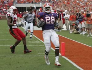 Clemson's C.J. Spiller (28) runs into the end zone for a 35 yard touchdown run as Maryland's Jeff Allen (29) looks on during the first half. (AP Photo/Mary Ann Chastain)