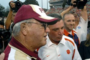 Clemson's head football coach Tommy Bowden, right, joins his father Florida State's head coach Bobby Bowden before the start of their football game Monday Sept. 3, 2007, at Memorial Stadium in Clemson, S.C. (AP Photo/John Byrum)