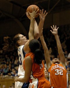 Duke's Alison Bales, left, shoots over Clemson's Adrianne Bradshaw (50) and Morganne Campbell (32) in the first half of a basketball game in Durham, N.C., on Monday, Feb. 5, 2007. (AP Photo/Sara D. Davis)
