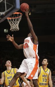 Clemson's James Mays dunks over West Virginia's Rob Summers, right, and West Virginia's Alex Ruoff during the second half. (AP Photo/Seth Wenig)