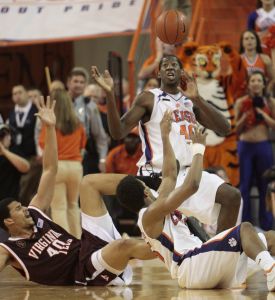 Virginia Tech's A.D. Vassallo battles for a loose ball against James Mays and Cliff Hammonds. (AP Photo/Patrick Collard)