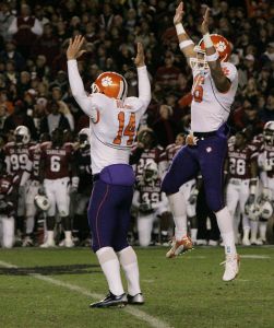 Clemson's Mark Buchholz (14) celebrates with his Michael Wade (16) after kicking the game-winning field goal as time expired to defeated South Carolina 23-21 in a college football game Saturday, Nov. 24, 2007, at Williams Brice Stadium in Columbia, S.C. (AP Photo/Mary Ann Chastain)