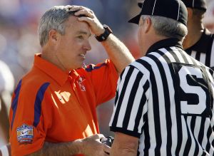 Clemson coach Tommy Bowden talks with side judge Phil Laurie during a football game against Kentucky during the second quarter of the Music City Bowl football game in Nashville, Tenn. on Friday, Dec. 29, 2006. (AP Photo/John Russell)