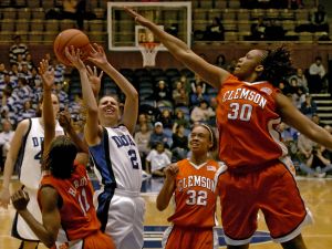 Duke's Emily Waner (2) shoots over Clemson's Lele Hardy (11) and Moreemi Davis (30) in the second half of a basketball game in Durham, N.C., on Monday, Feb. 5, 2007. Duke won 105-53 over Clemson. (AP Photo/Sara D. Davis)