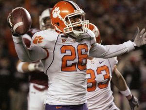 Clemson's La Donte Harris (26) runs the ball in for a touchdown after a blocked punt during the first quarter of a football game against South Carolina on Saturday, Nov. 24, 2007, in Columbia, S.C. (AP Photo/Mary Ann Chastain)