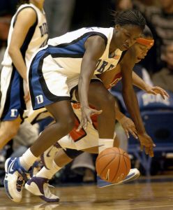 Duke's Bridgette Mitchell, left, chases a loose ball over Clemson's Christy Brown, right, in the second half of a basketball game in Durham, N.C., on Monday, Feb. 5, 2007. Duke won 105-53 over Clemson. (AP Photo/Sara D. Davis)