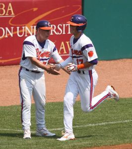 Steve Wilkerson was congratulated by Head Coach Jack Leggett after hitting a home run in the first inning against Georgia Tech.
