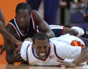 Sam Perry winces as he hits the floor diving for a loose ball with Mississippi's Clarence Sanders in a second-round NIT game in Clemson, S.C., Monday, March 19, 2007. (AP Photo/Independent-Mail, Sefton Ipock)