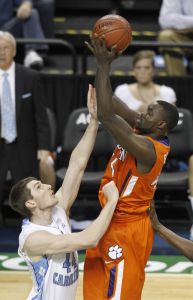 Clemson's Jerai Grant, right, shoots over North Carolina's Tyler Zeller, left, in the first half of an NCAA college basketball game at the Atlantic Coast Conference tournament in Greensboro, N.C., Saturday, March 12, 2011. (AP Photo/Chuck Burton)