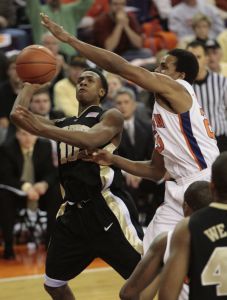 Cliff Hammonds, right, tries to block the shot of Wake Forest's Ishmael Smith during the second half of the basketball game in Clemson, S.C., Tuesday, Jan. 22, 2007. Clemson won 80-75 in overtime. (AP Photo/Patrick Collard)