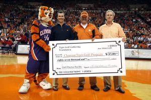 charles warren, larry penley, tiger golf gathering fundraiser check presentation